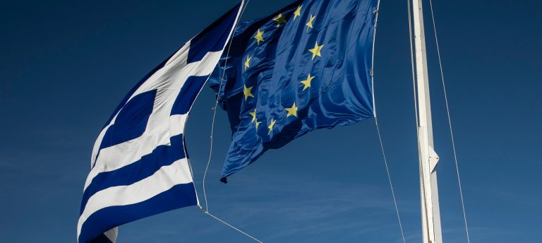 Greek and European flags wave